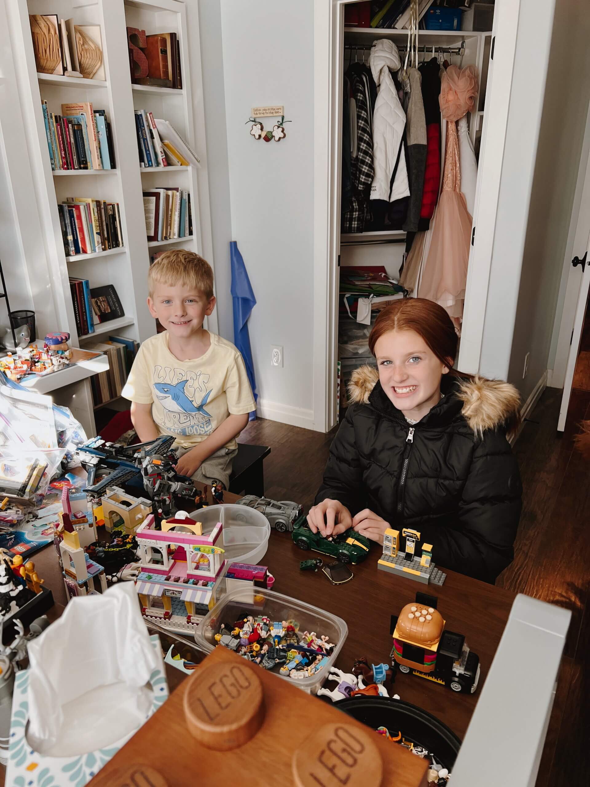 two kids playing with legos